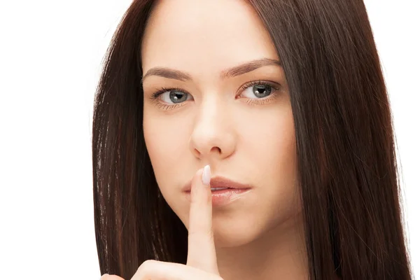 Picture of woman with finger on lips — Stock Photo, Image