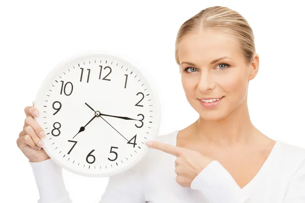 Woman holding big clock Royalty Free Stock Images