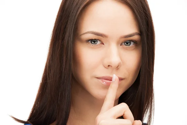 Bild på kvinna med fingret på läppar — Stockfoto