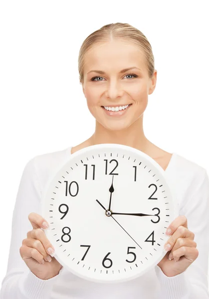 Woman holding big clock Stock Image
