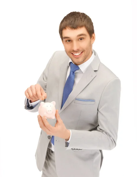 Handsome man with piggy bank — Stock Photo, Image