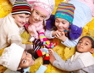 Kids in scarves and hats clipart