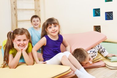 Kids on tumbling mats clipart