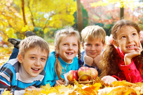 Kids group in autumn park — Stock Photo, Image