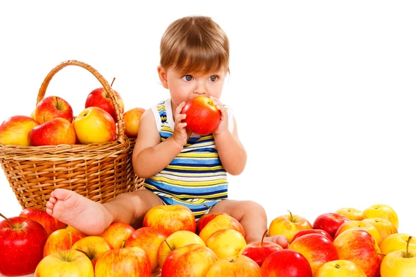 Toddler eating ripe apple — Stock Photo, Image