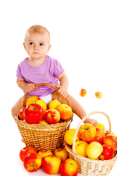 Baby on apple heap — Stock Photo, Image