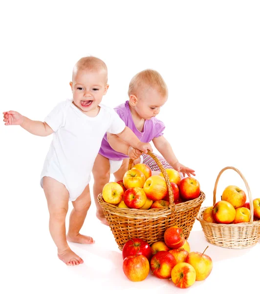 Babies with ripe apples — Stock Photo, Image