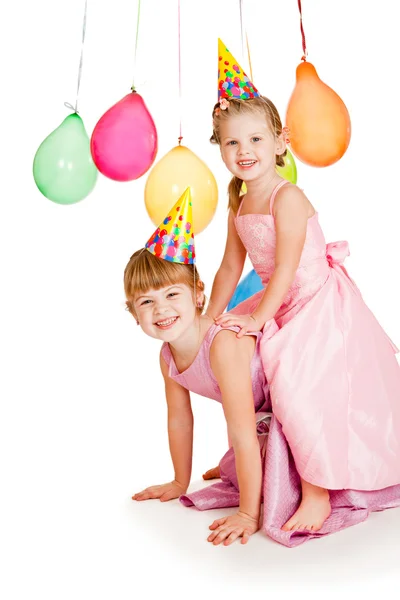 Sisters in party hats — Stock Photo, Image