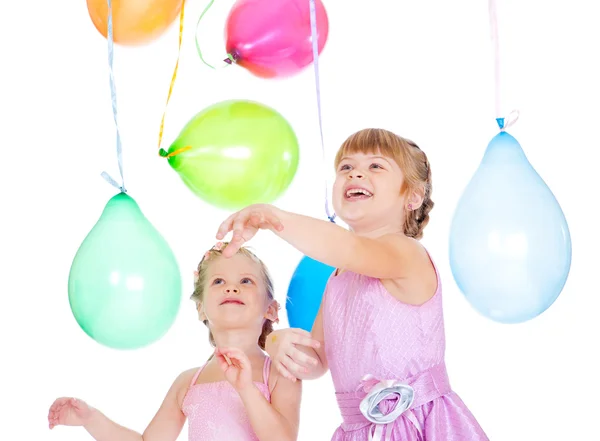 Irmãos brincando com balões — Fotografia de Stock