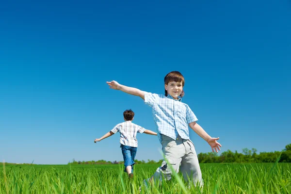 Cheerful kids running — Stock Photo, Image