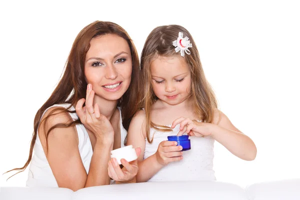 Mother and daughter with cream — Stock Photo, Image