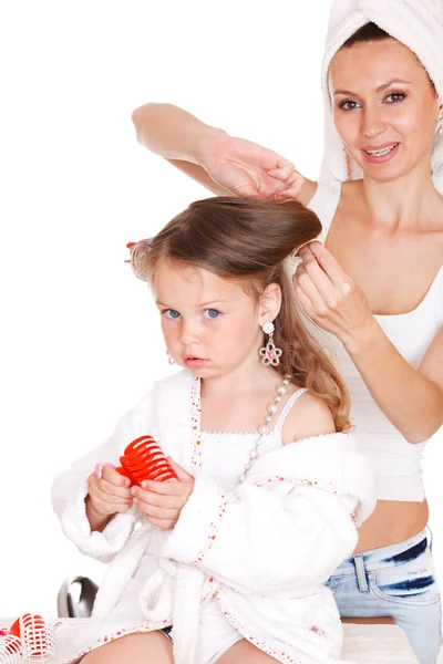 Styling daughter's hair — Stock Photo, Image