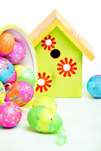 Easter eggs with bird house — Stock Photo, Image