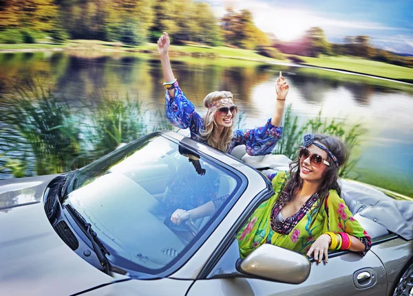 Smiling women in a cabriolet — Stock Photo, Image