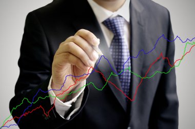 Businessman analyze the stock exchange graph clipart