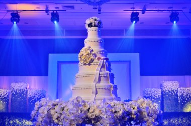 Wedding cake with stage lighting clipart