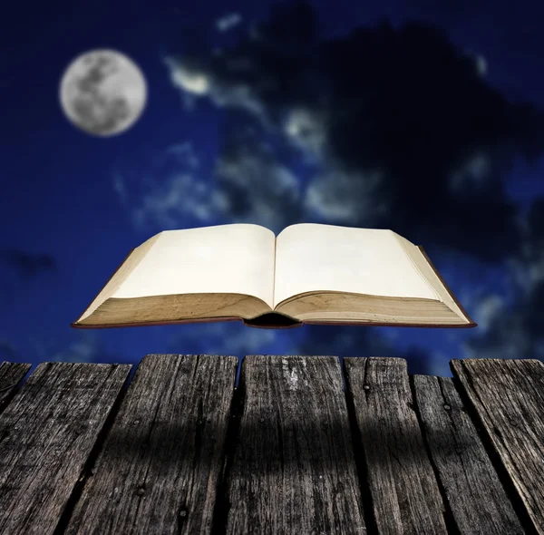 Mystery flying book with night sky — Stock Photo, Image