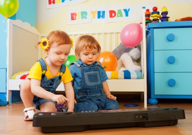 Girl with boy playing piano clipart