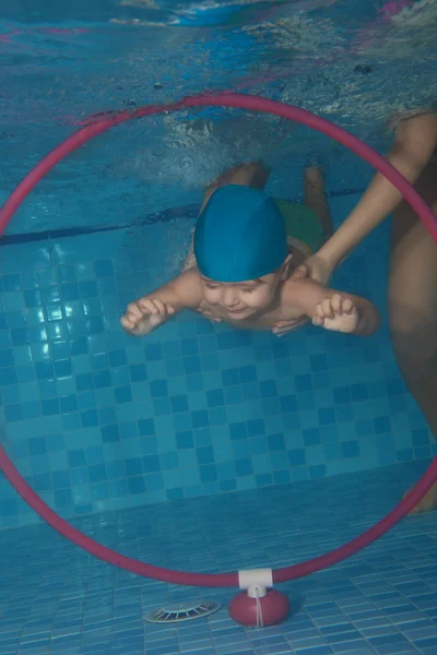 Toddler swimming exercises — Stock Photo, Image