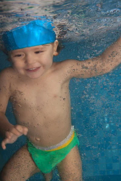 Happy toddler jumping in the pool — Stock Photo, Image