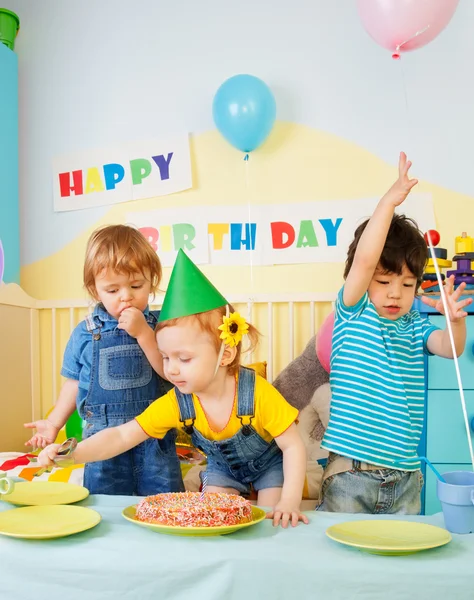 Three kids having fun on the birthday party — Stock Photo, Image