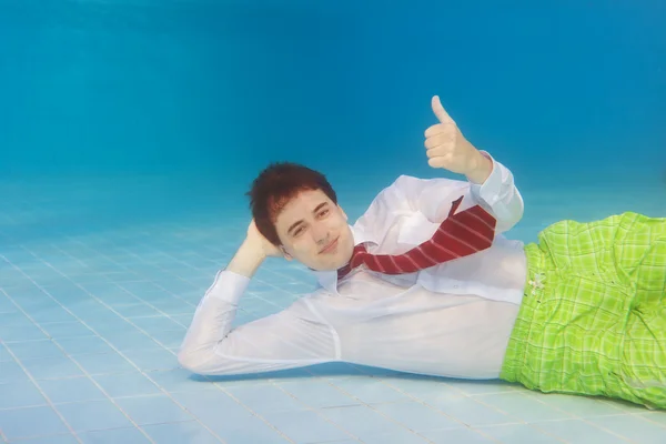Businessman underwater with thumbs up — Stock Photo, Image