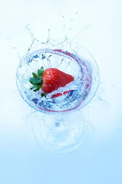 Fresh strawberry splash in glass — Stock Photo, Image