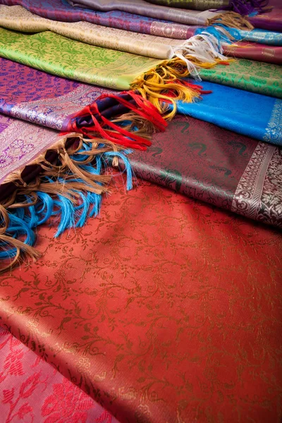 Different beautiful fabrics with fringe — Stock Photo, Image