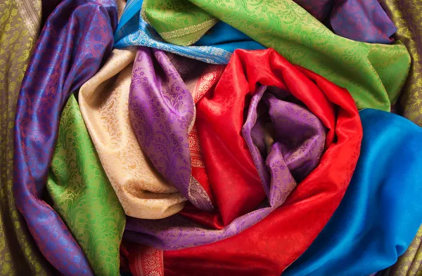 Rolls of fabrics on the table — Stock Photo, Image