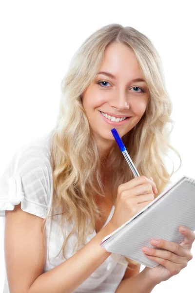 Mulher loira segurando caneta e bloco de notas — Fotografia de Stock