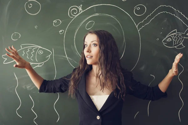 Girl over chalkboard like a diver — Stock Photo, Image