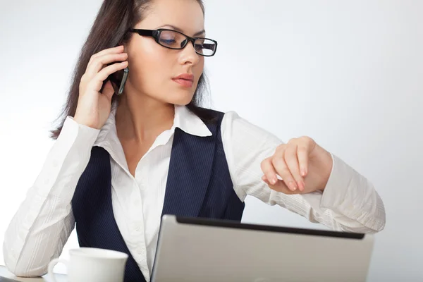 Businesswoman looking at mobile phone — Stock Photo, Image