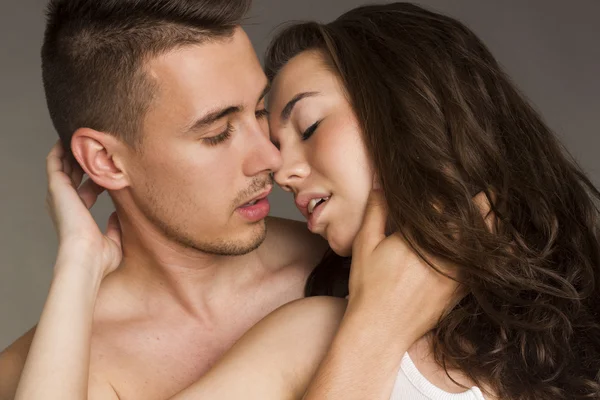 Young sexy couple in studio — Stock Photo, Image