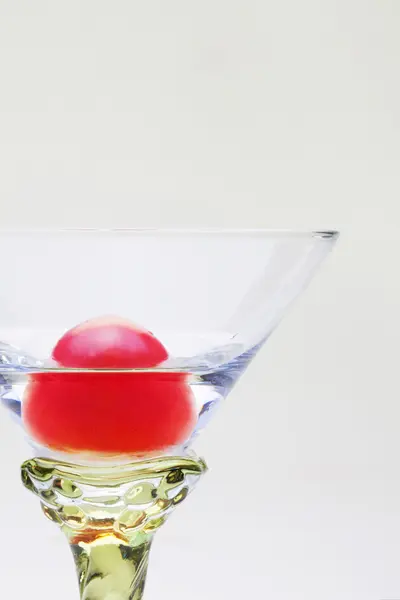 A Cherry tomato in the glass — Stock Photo, Image