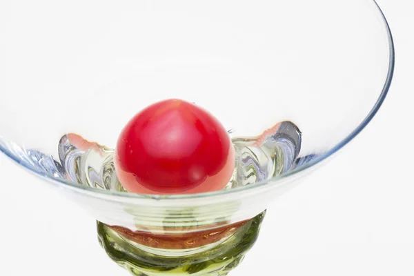 A Cherry tomato in the glass — Stock Photo, Image