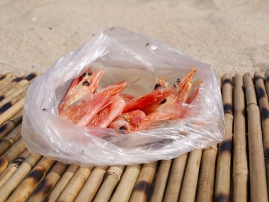 Doubtful shrimps in a package clipart