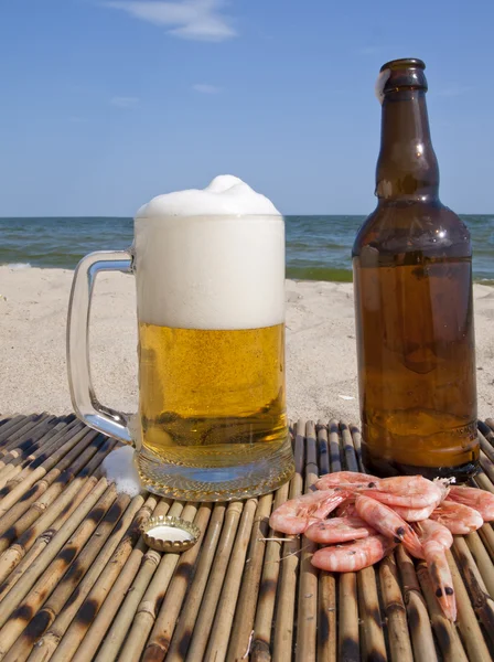 Glass with beer and a bottle — Stock Photo, Image