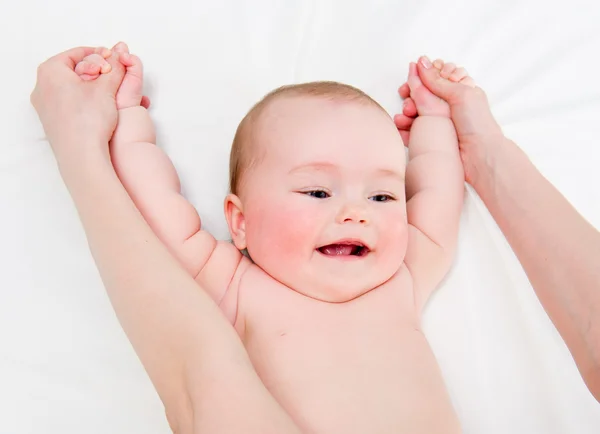 Mother massaging her lovely baby — Stock Photo, Image