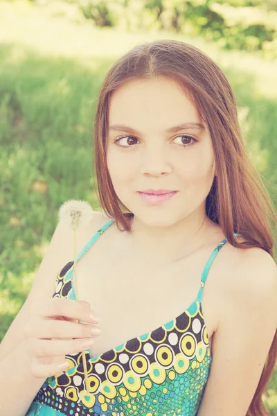 Girl with a dandelion — Stock Photo, Image