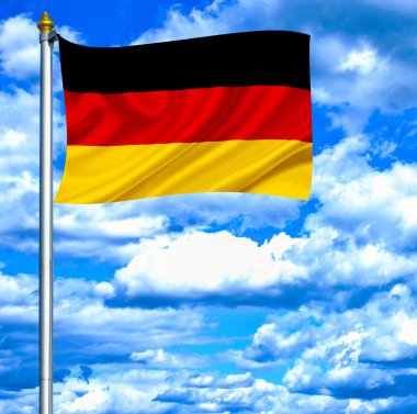 Mavi gökyüzü karşı bayrak sallayarak Almanya