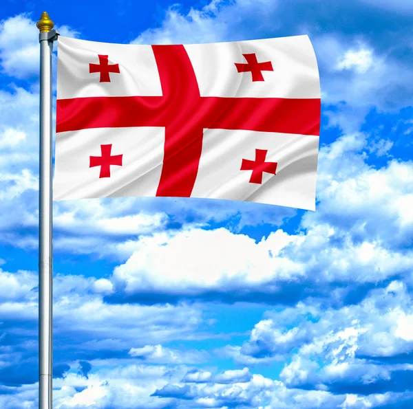 Géorgie agitant drapeau contre ciel bleu — Photo
