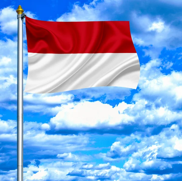Indonesië zwaaien vlag tegen blauwe hemel — Stockfoto