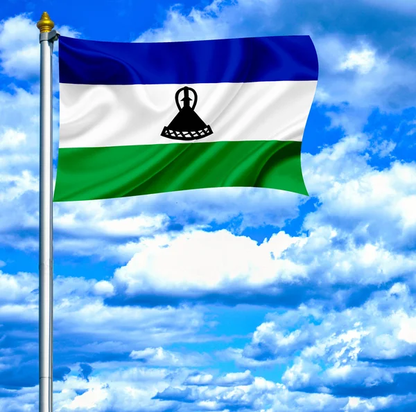 Lesotho ondeando bandera contra el cielo azul —  Fotos de Stock