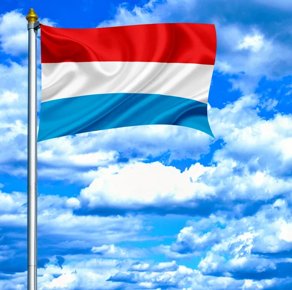 Luxembourg waving flag against blue sky — Stock Photo, Image