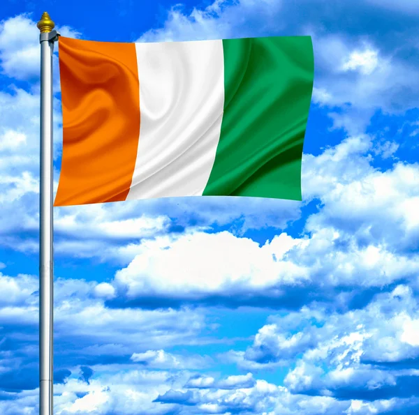 stock image Ivory Coast waving flag against blue sky