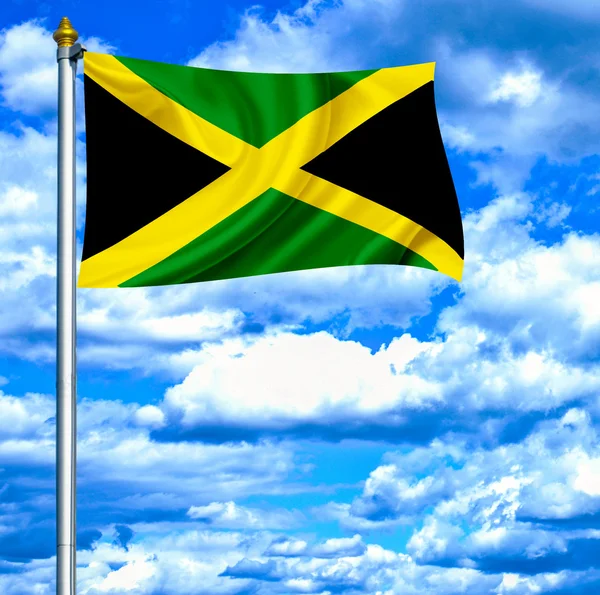 Ямайка размахивает флагом на фоне голубого неба — стоковое фото