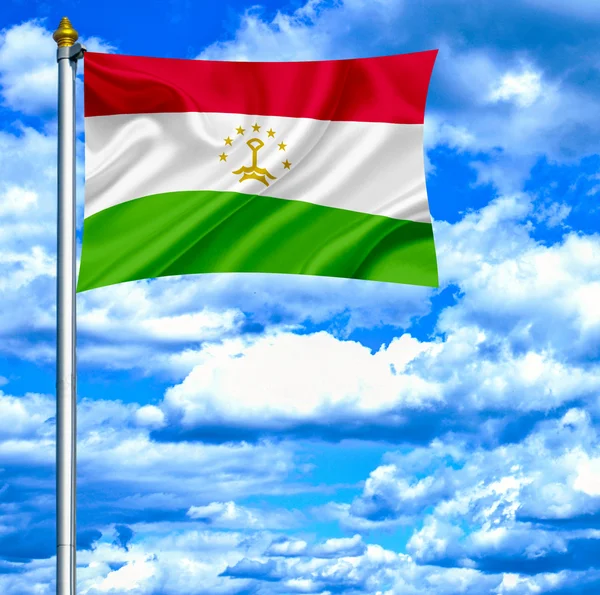 Tajiquistão agitando bandeira contra o céu azul — Fotografia de Stock