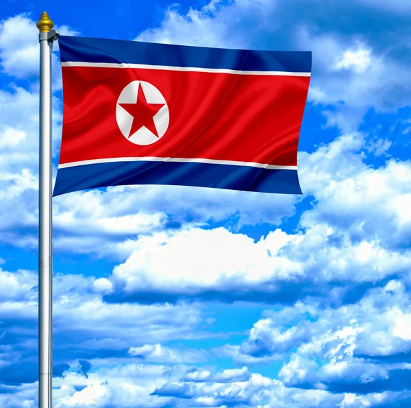 Noord-korea zwaaien vlag tegen blauwe hemel — Stockfoto