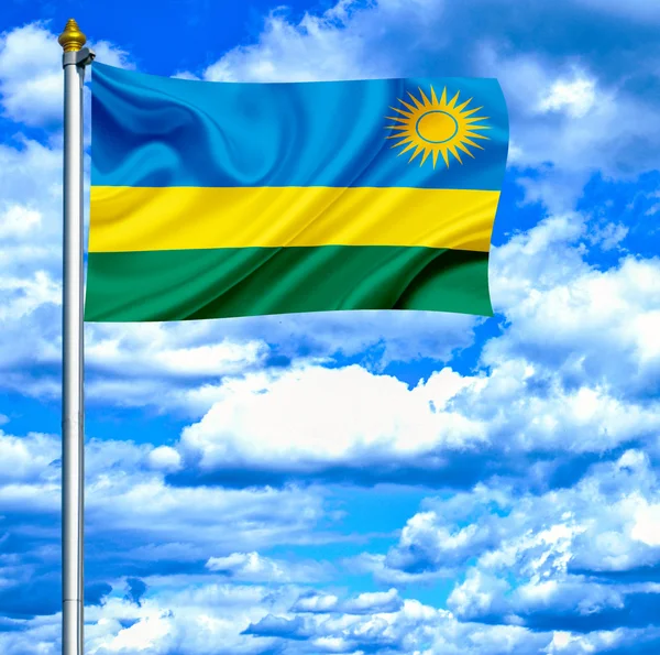 Ruanda schwenkt Flagge gegen blauen Himmel — Stockfoto