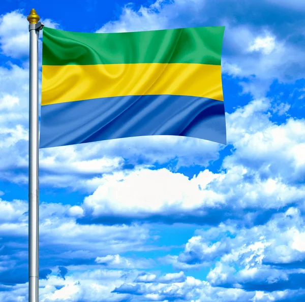 Gabon viftande flagga mot blå himmel — Stockfoto